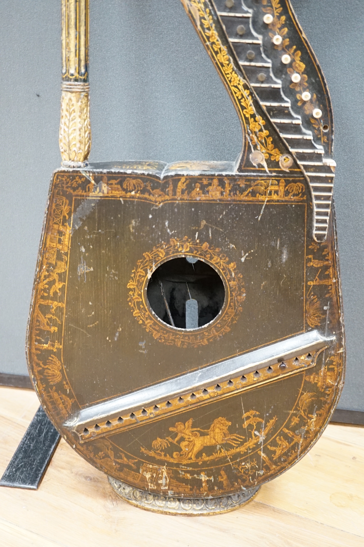 A Georgian parcel gilt and ebonised harp-lute by Edward Light, with fluted pillar, Royal coat of arms above patent number and ‘Light, Toley Place, London’, buttons to reverse with note letters, 88.5cm high CITES Submissi